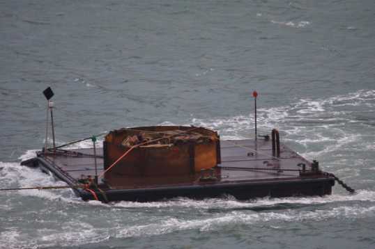 18 December 2021 - 09-43-18
What could be inside the intriguing looking   load aboard the towed barge ?
------------------
Tug Obervargh arrives in Dartmouth